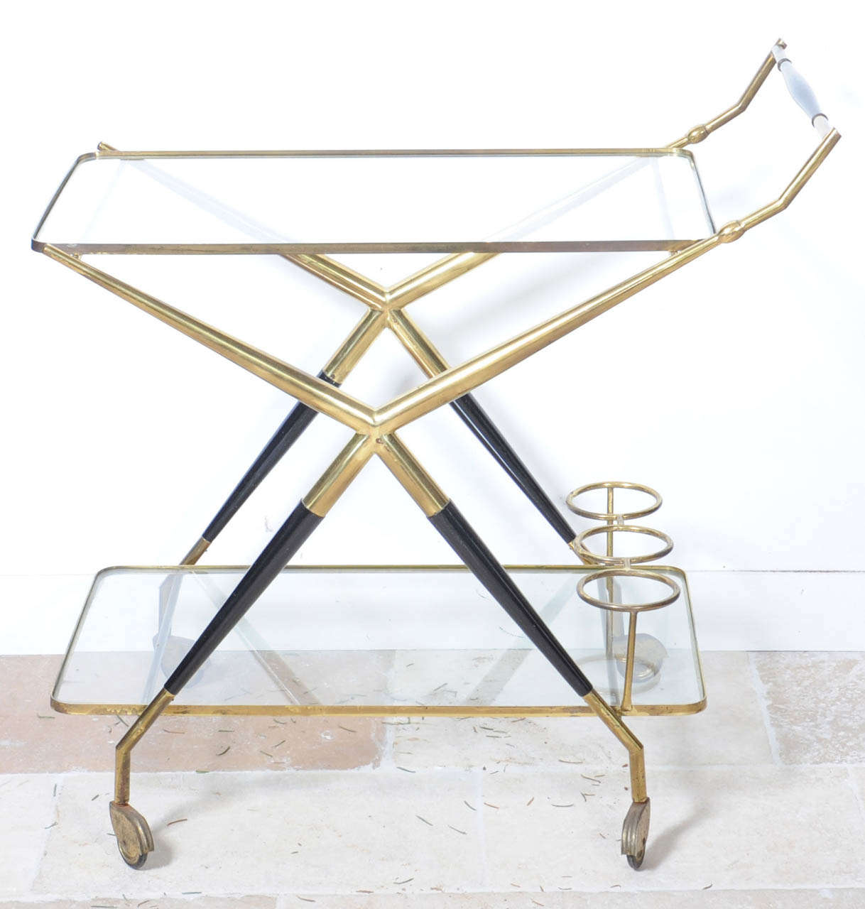 A 1950's vintage brass and ebonised wood bart cart by Cesare Lacca.