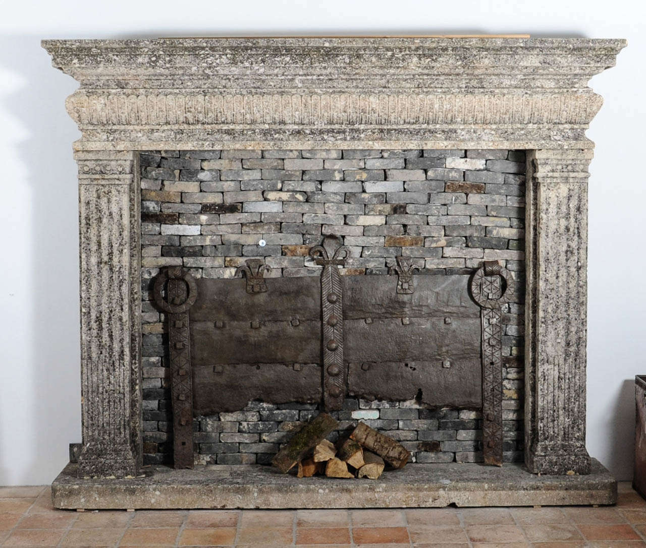 This very large hand carved limestone Italian fireplace/mantelpiece was build in a Renaissance style. The limstone has got a beautiful patine. 

Height 195 cm, depth 45 cm, width 241. The inner dimensions are 169 in width and 140 cm in height. 