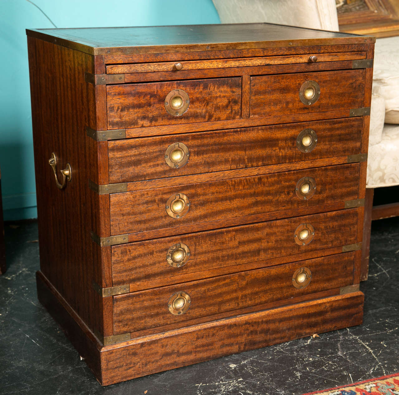 A Pair of military style brass bound mahogany side chests with 6 drawers and leather tip with pull out brass slides