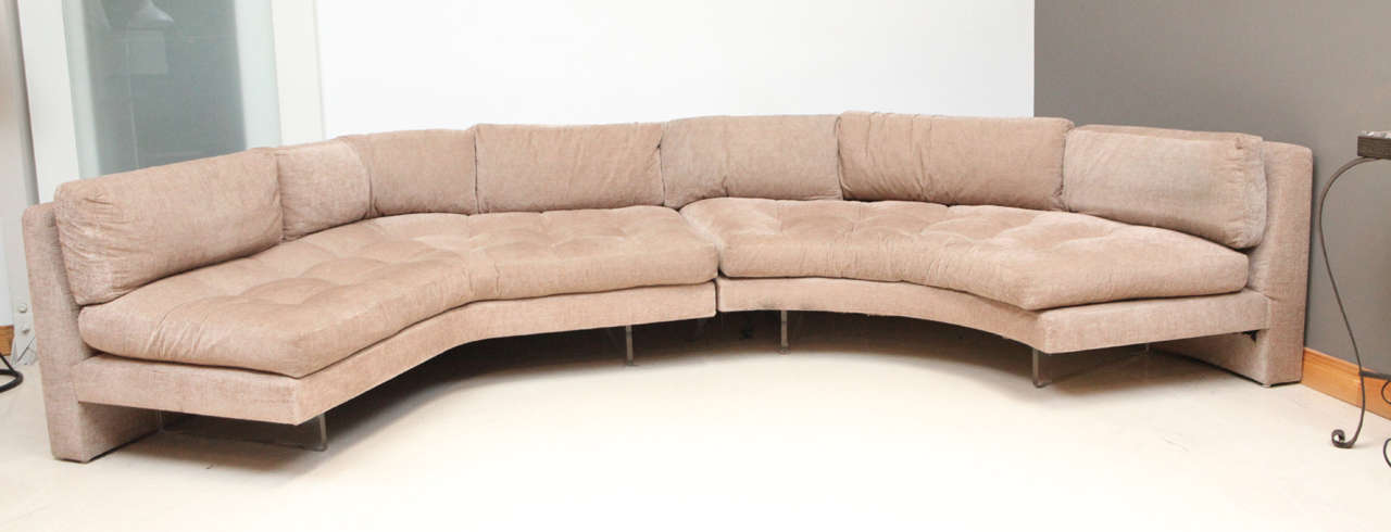 Vladimir Kagan Ominibus two-part sectional sofa with Lucite base and original upholstery.