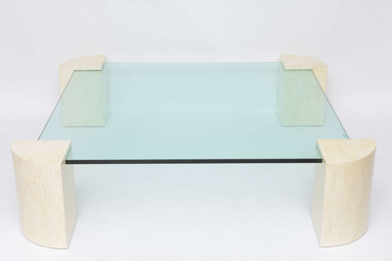 Four tessellated bone corners support the large, 3/4-inch thick, green-hued glass top of this impressively-scaled coffee table. We picture it in a chic ocean front home, its colors evocative of sea and sugar sand!