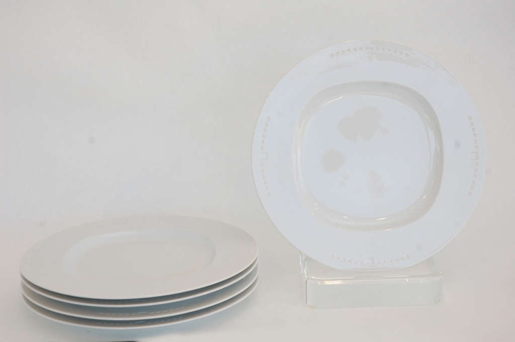 A clean, contemporary china design, this group of five plates in the 