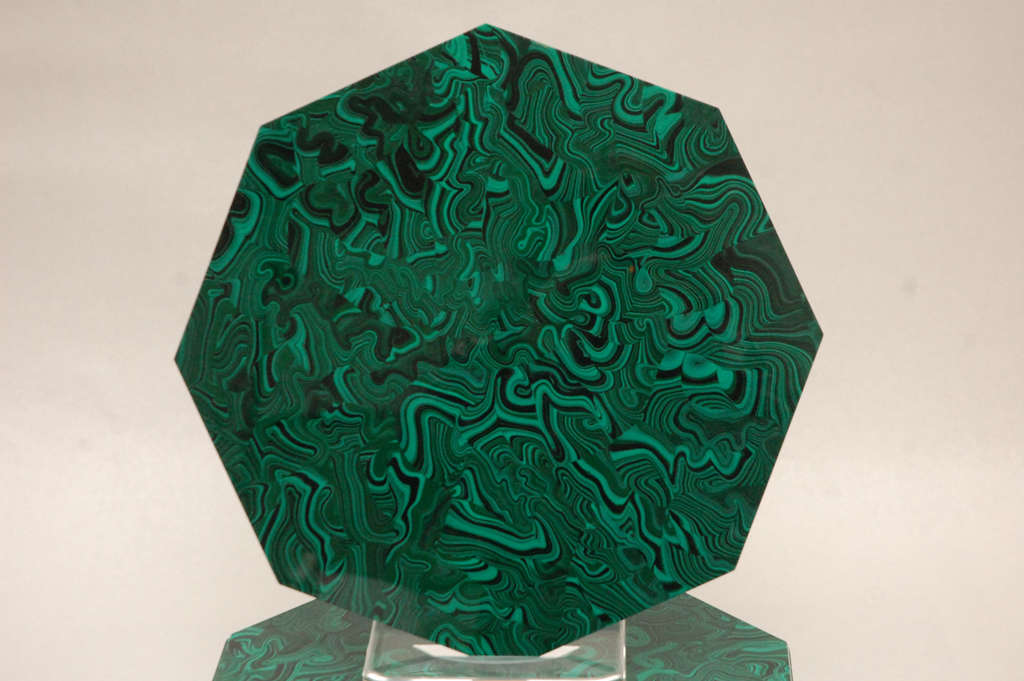 A stylish set of twelve octagonal poured resin faux malachite placemats.