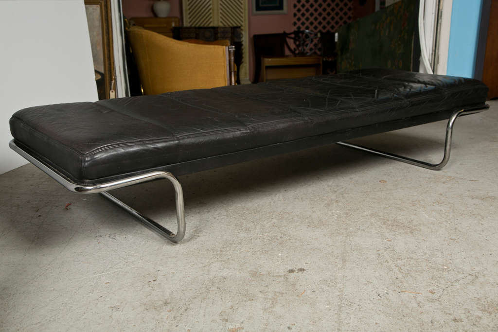 Bauhaus style daybed with chrome base holding black leather
mattress. Base is visible at each end. The bed is made by 
Brayton International Company in High Point, N.C.
Estimate date is circa 1970. Mattress has Urethane Foam core
