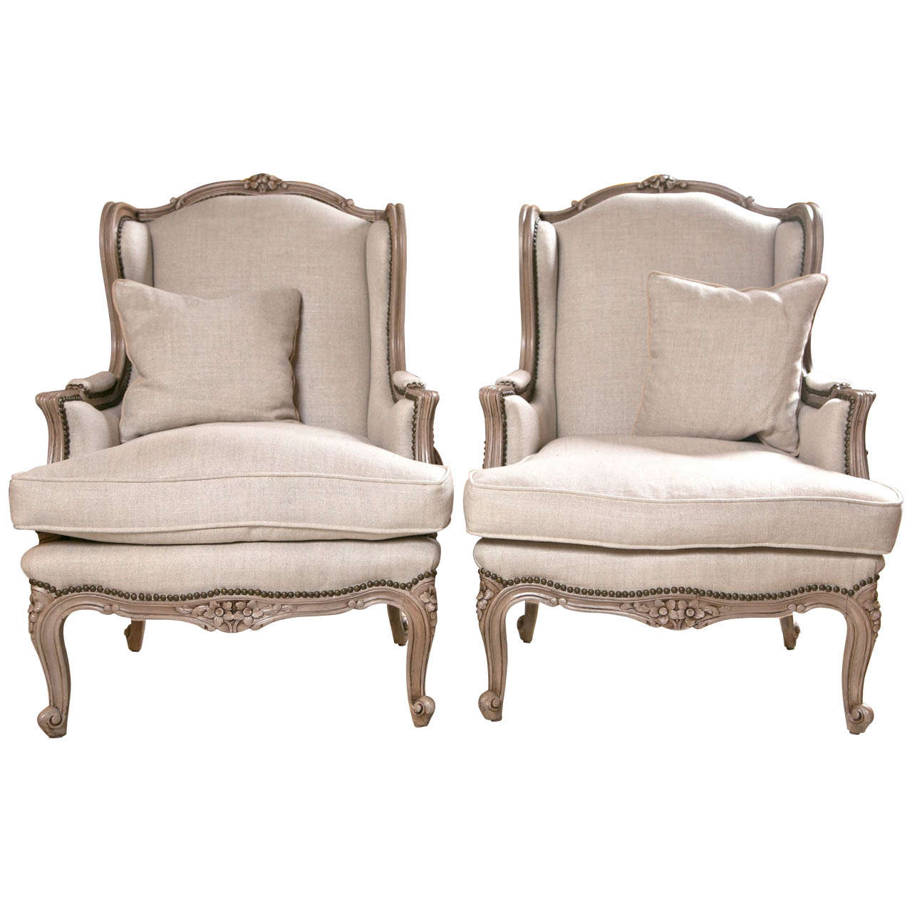 Pair of French Wingback Chairs In Linen Upholstery with Nail Heads