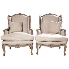 Pair of French Wingback Chairs In Linen Upholstery with Nail Heads