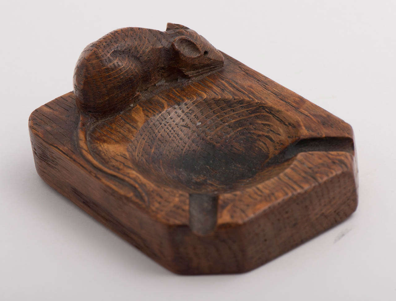 A Robert  “Mouseman” Thompson Oak Ashtray.
Carved Mouse.
English.
Circa 1970
2 x 10 x 7.5 cms.