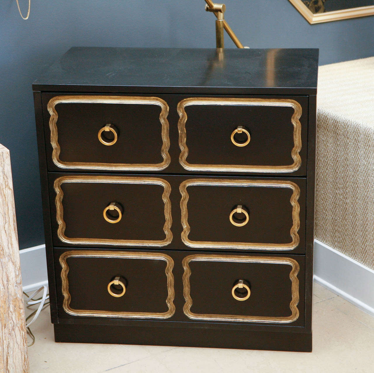 Vintage Dorothy Draper style chest with drawers.  Classic black with gold trim and brass hardware.