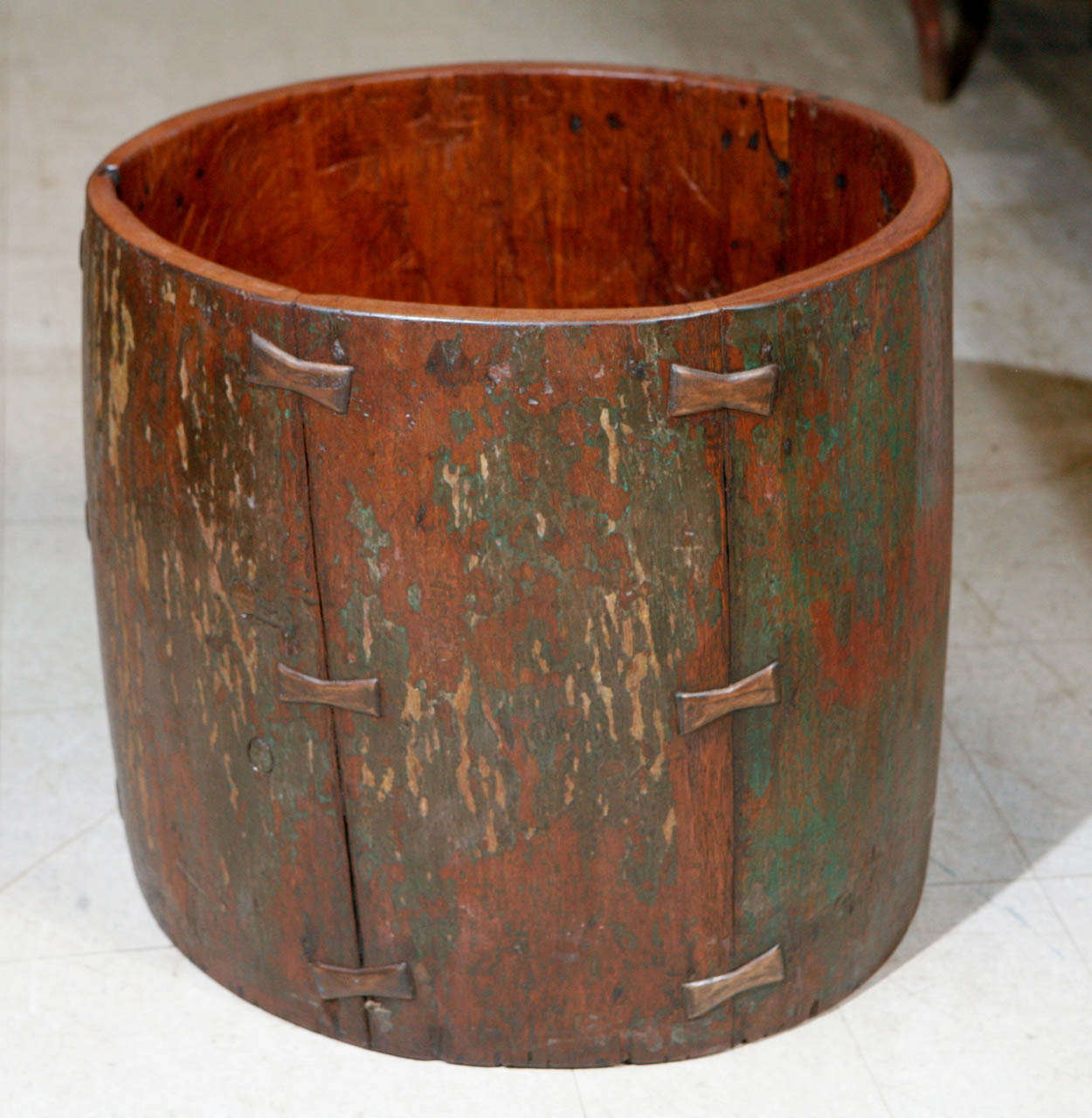 Antique teak hardwood drum vessel of a cylindrical form with twelve butterfly insert, rural Java, circa 1900.
