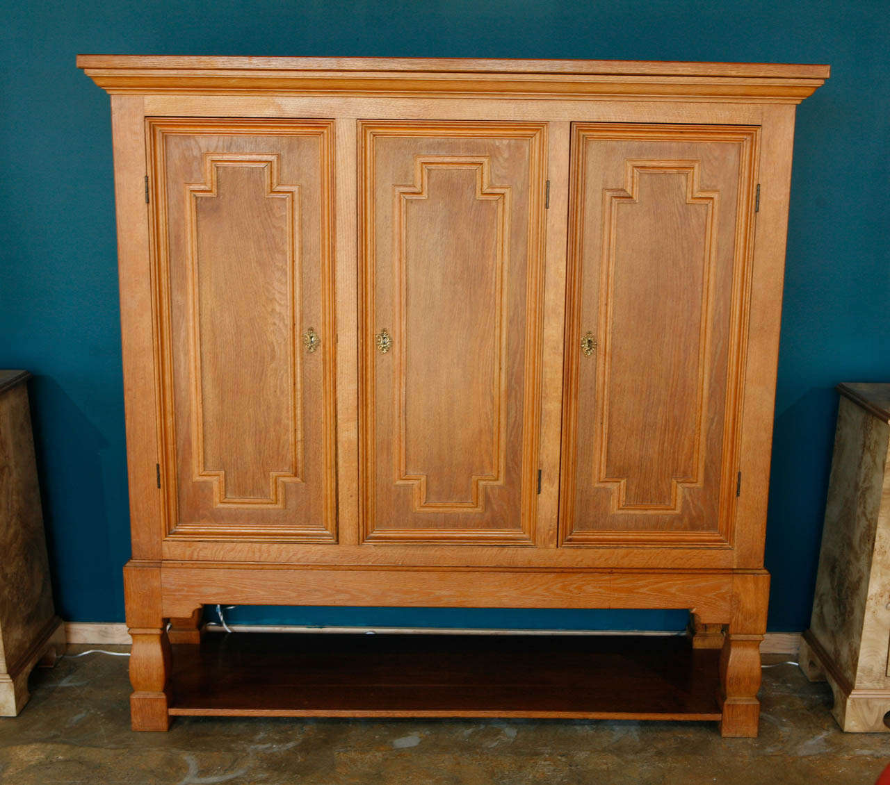 Three-door French oak cabinet.
Visit the Paul Marra storefront to see more furnishings and lighting including 21st Century.