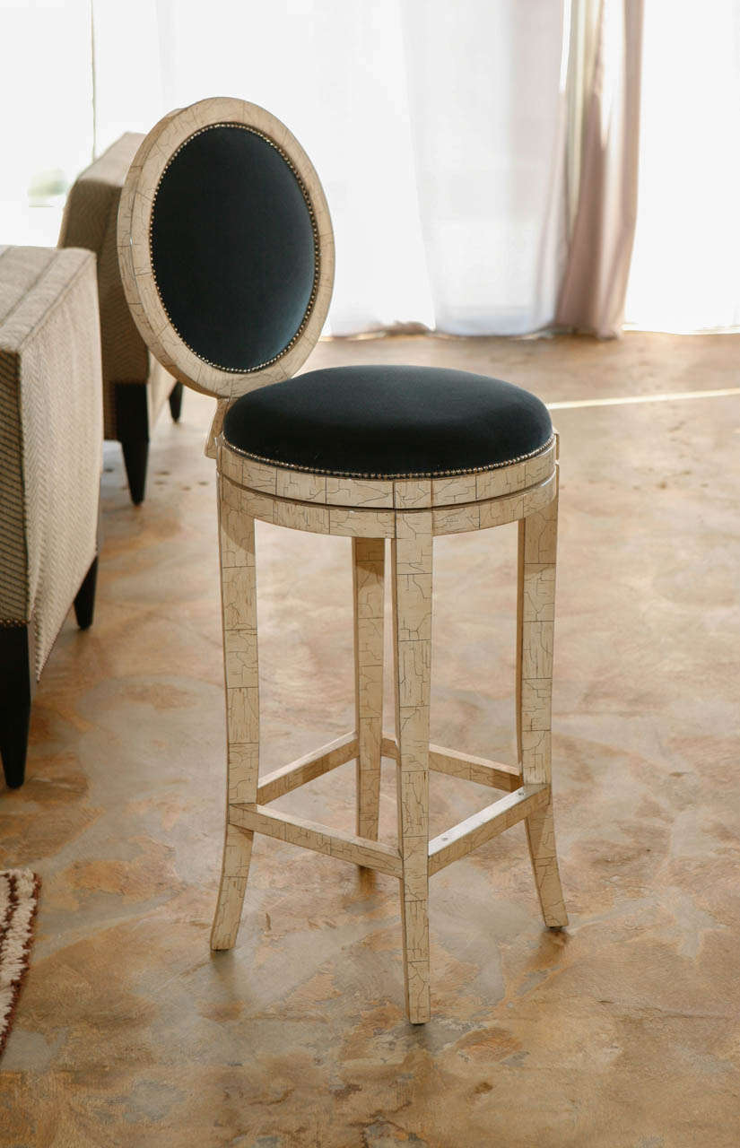 Bar stool with swivel seat shown in faux ivory finish, by order and by order in other finish (specify).