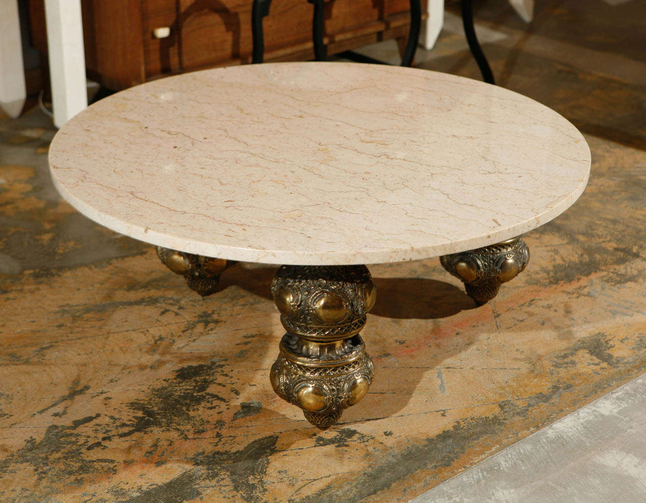 Mid-century coffee table with Morrocan style base and marble top.