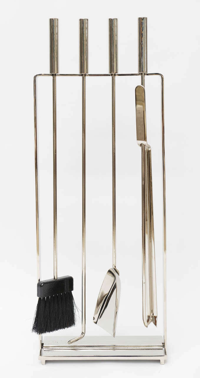 Sleek and simple Modernist fireplace tool set by Pilgrim. Heavy nickel-plated wrought iron.