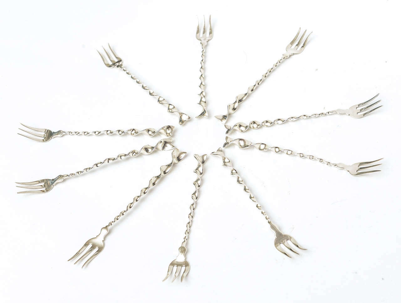 These wonderful vintage hallmarked sterling cocktail or serving forks add beauty to any table. They have a twist and ball with a gold wash. Elegant and timeless! They are by the company Whiting. These are from the 1900s but work great in a modern