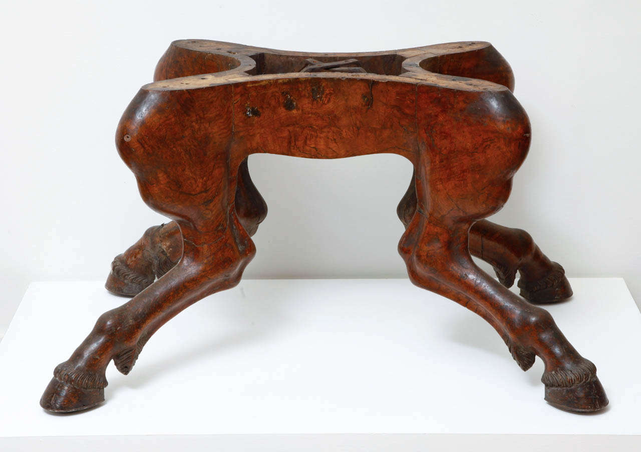 Very rare saddle support made of four sculpted horse legs terminated by horse shoes. The construction that carried the saddle is missing.

H. 57 cm W. 100 cm, D. 68 cm