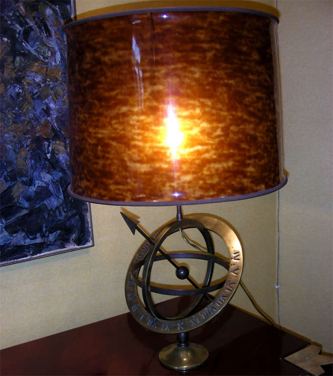 Astrolabe table lamp made of bronze with an imitation tortoise shell lampshade.