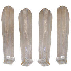 4 wall sconces in murano glass.