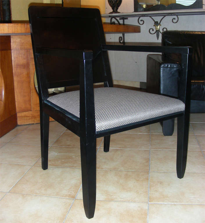 Two 1940s black wood armchairs and four chairs by Maurice Alet, edited by Jauvert et Alet; original label under the seating. Chairs length 45 cm., depth 48 cm. Other dimensions are identical to armchairs' and are given below. Backrest padding is not