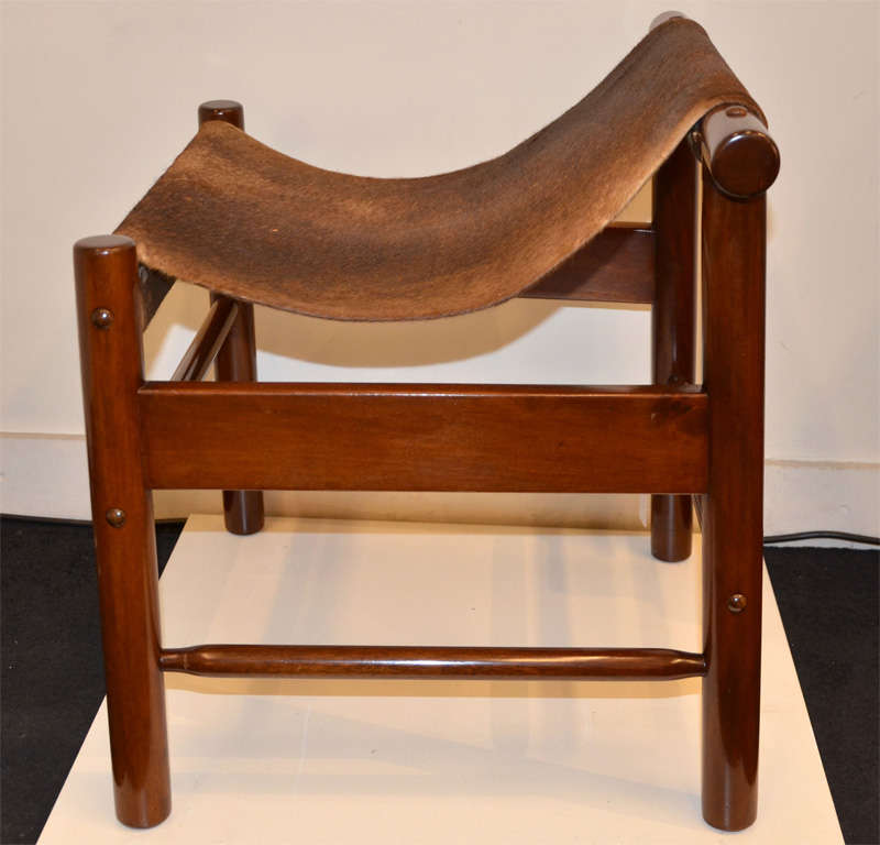 A pair of  wood and colt skin stools by Dujo . 2