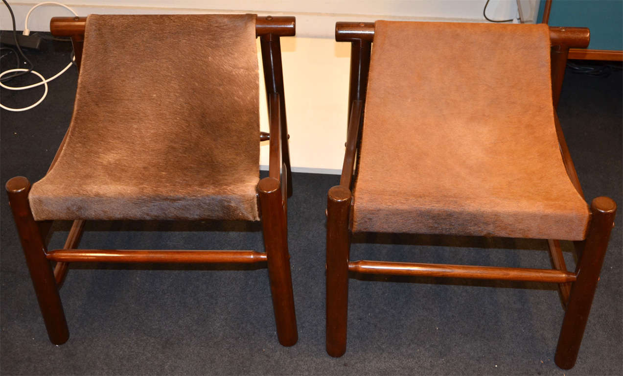 A pair of  wood and colt skin stools by Dujo . 5