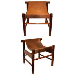 A pair of  wood and colt skin stools by Dujo .