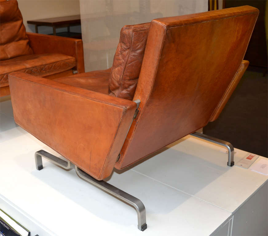 Rare pair of armchairs, model PK 31 in havane leather with a nice vintage patina, first edition by Kold Christiansen, stamped.