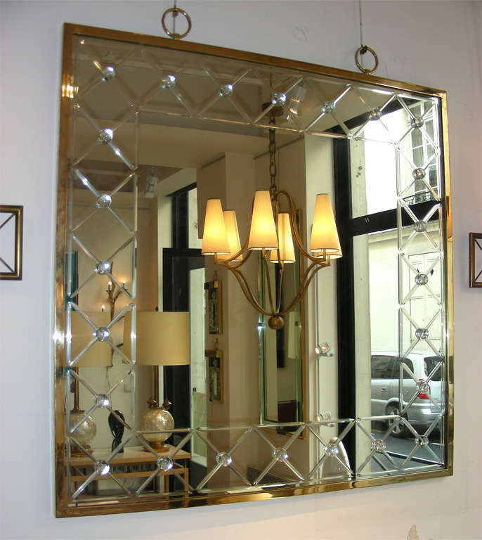 engraved mirror with a half rock cristal cabochon at each crossing of engraving