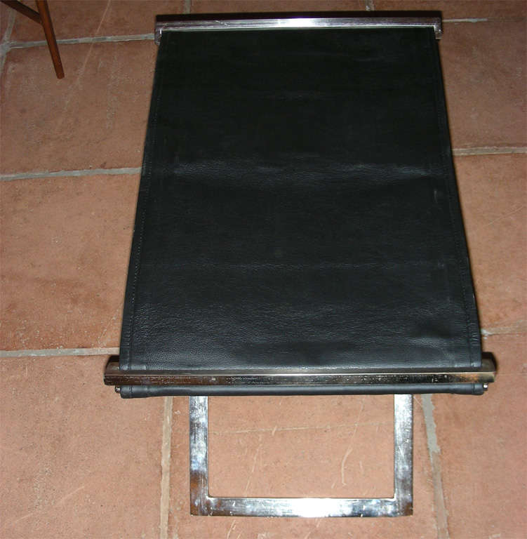 Leather pair of folding stools in steel and black leather