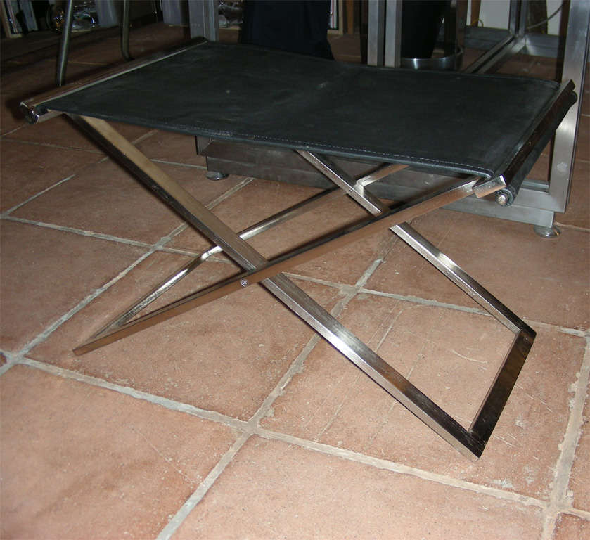 pair of folding stools in steel and black leather 1