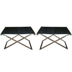 pair of folding stools in steel and black leather