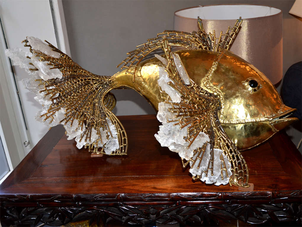 1970' French lighting sculpture by Richard Faure representing a fish.Body in polished and patinated brass, the fins are decorated with gypsum crystals arrows and hide three light bulbs. Eyes in molten glass. Can also be used as a coffee table,  with