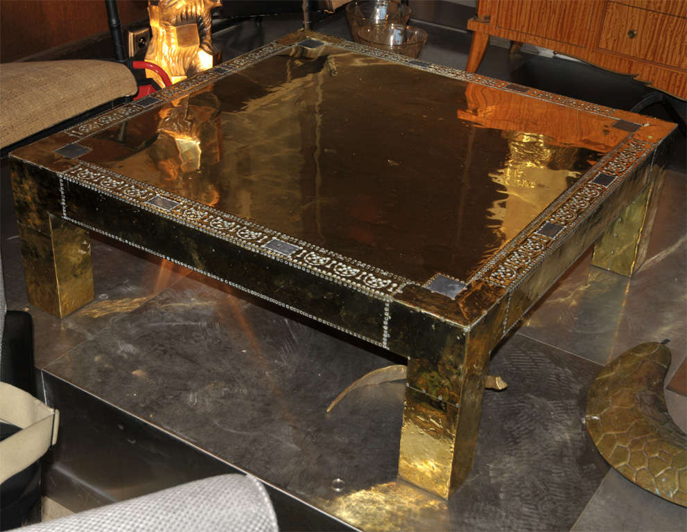 1970s coffee table covered in gilded brass, signed by R. Dubarry;