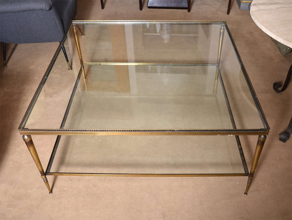 Beautiful coffee table with two glass shelves, brass feet. French labor

glass and brass
Beautiful coffee table with two glass shelves, brass feet. French labor
