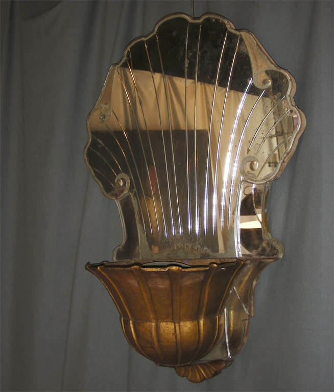 1940s wall light by Maison Baguès, in patinated metal and engraved gilt mirror.