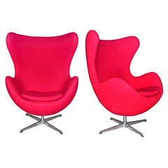 Vintage Pair of swivel tilt red egg chair by Arne Jacobsen