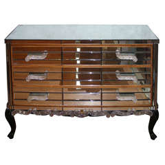 Commode in mirror with elements in murano glass.