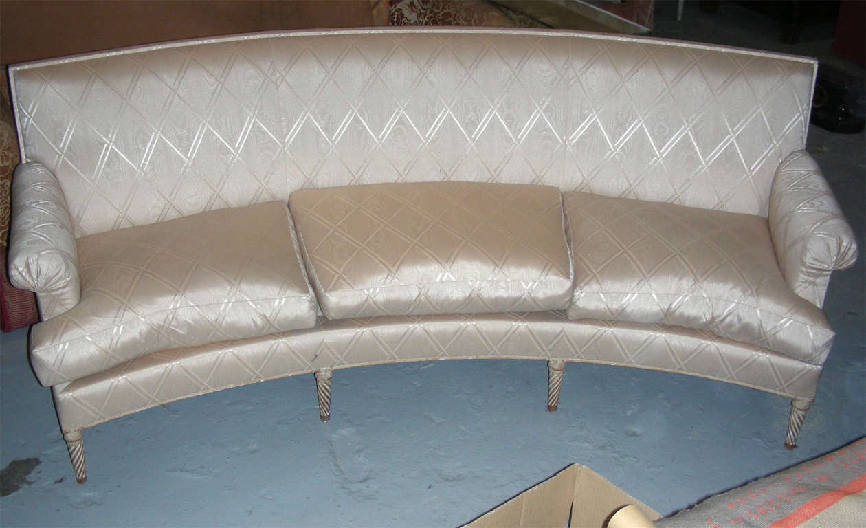 1940s three-seater sofa by Carlian, with twisted fluting legs, reupholstered.