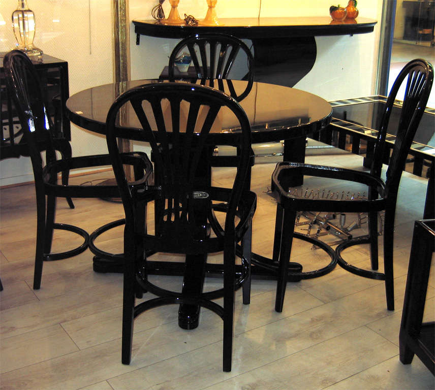 Table and 4 chairs by Thonet lacquered in black.