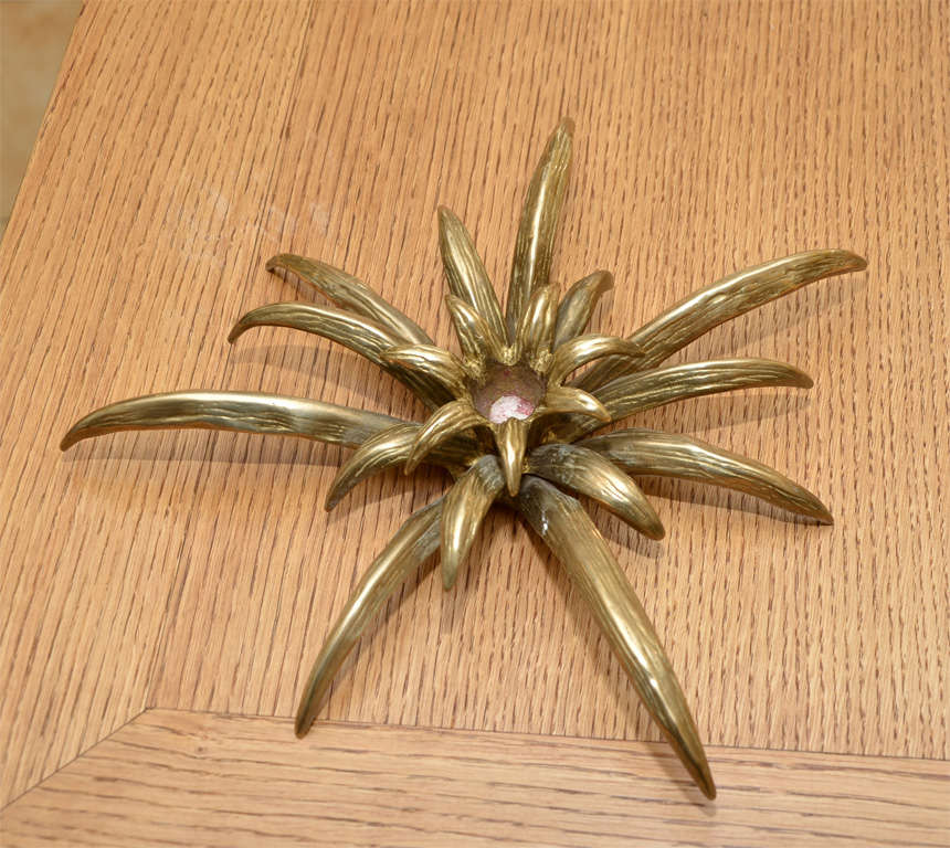 Two 1950s gilded bronze center-table decorations/candlestick shaped like a plant.