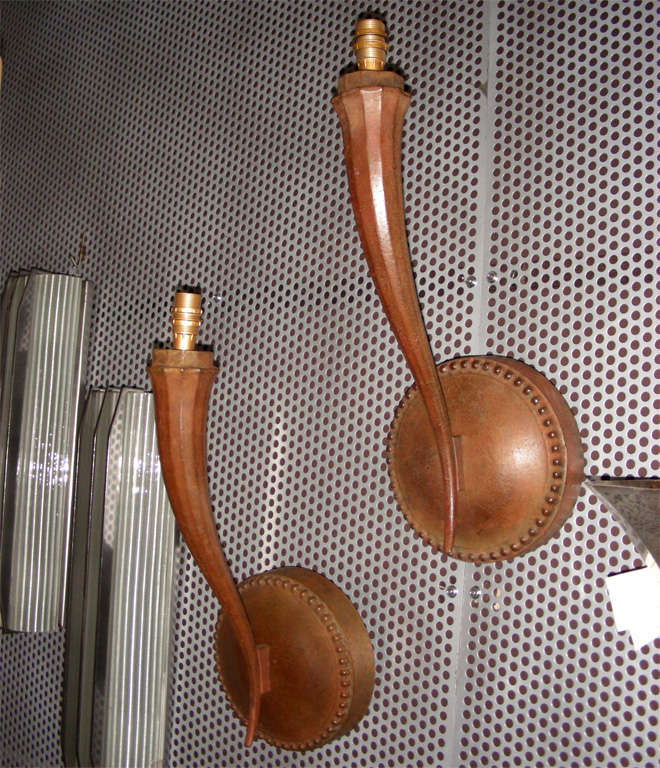 Two 1930s patinated bronze sconces attributed to Jacques Emile Ruhlmann, with one branch.