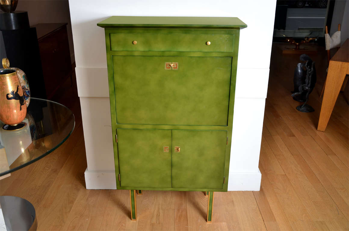 Little cloudy green lacquered secrétaire by Jules LELEU;1956.
Sain et Tambuté lacquer. Large drawer, front flap dorr and two doors under. Sycamore inside. Four gilt bronze and lacquered feet. Similar feet in F.Siriex, Les Leleu, Ed.2007,page 246.