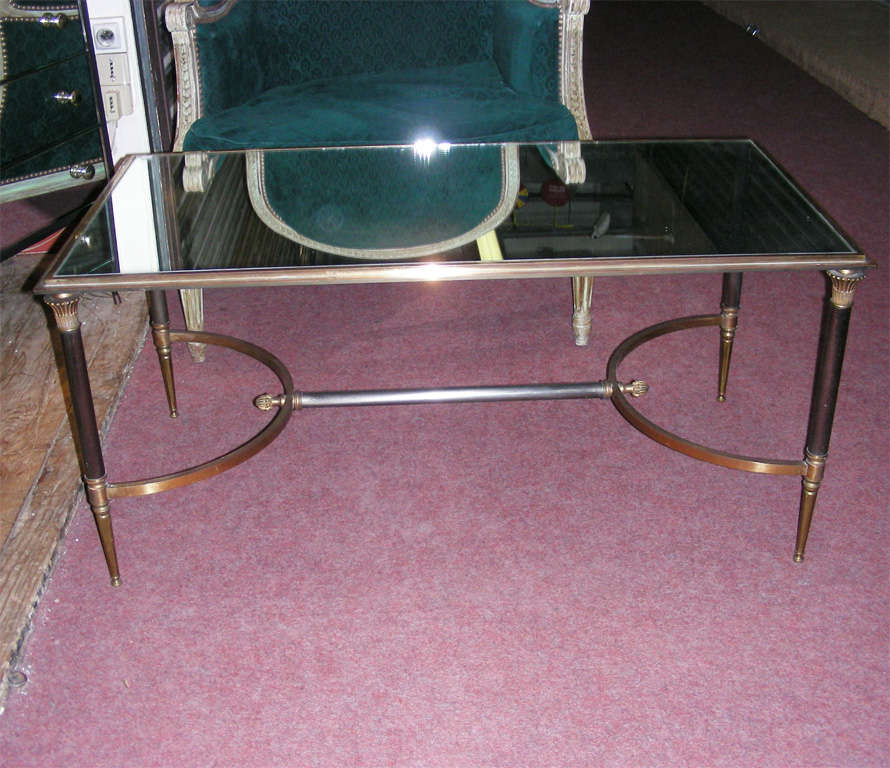 Two 1960s coffee tables by Maison Ramsay, with base in gilt and burnished bronze and top surface in mirror.
