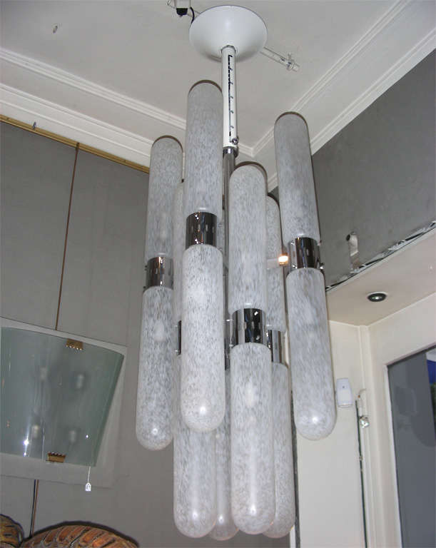 1960s Murano glass chandelier by Aldo Nason for Mazzega, with a system allowing the adjustment of the height. White and chrome metal elements.
Two chandeliers (a pair) avalaible.