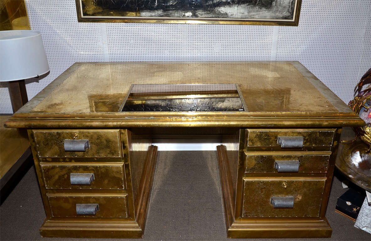 1970s desk signed by R. Dubarry, in engraved brass, with six drawers and a smoked mirror top surface.