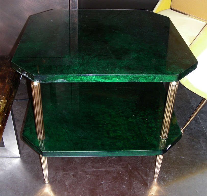 1960s Italian coffee table by Aldo Tura, with legs in gilded brass and two shelves clad in emerald green parchment.
Super rare color.
