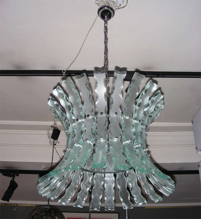 Italian chandelier by Zero Quattro, in molded frosted glass worked on a wheel, and chrome metal structure. Four lights.