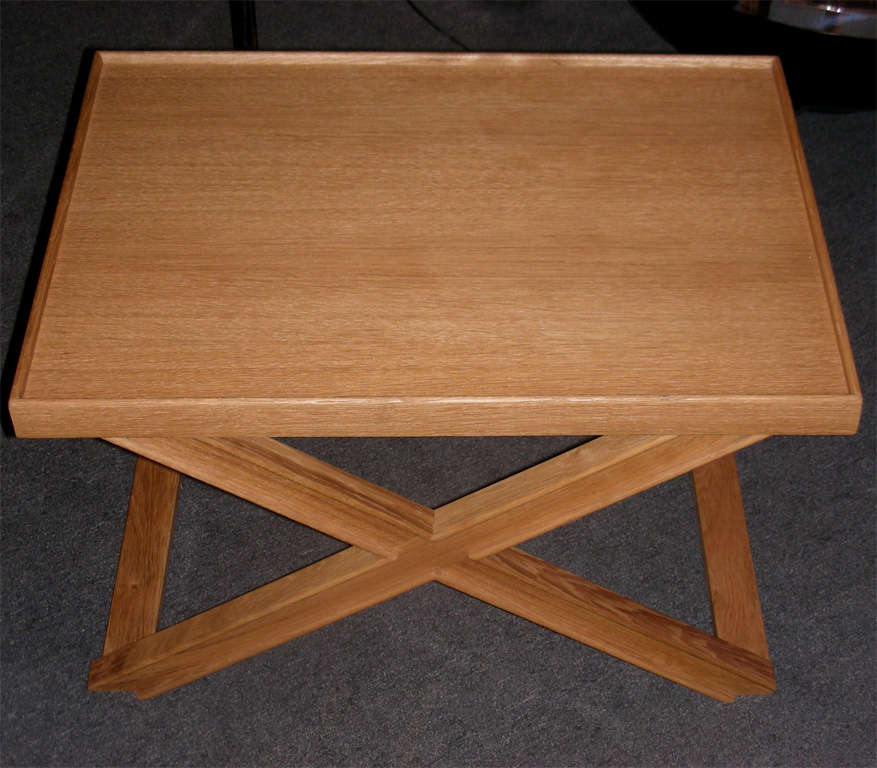 Two end of 20th century coffee tables by Jean-Michel Frank and Adolphe Chanaux, edited by Ecart International, in sanded and stained oak. This model was not reedited.