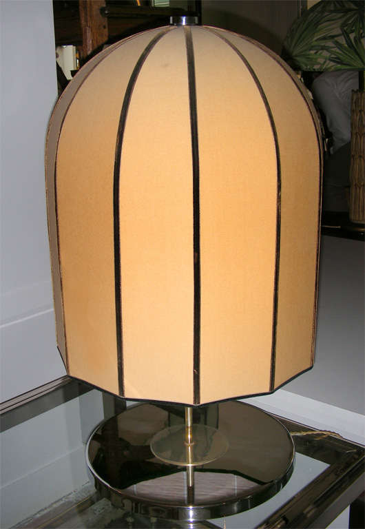 A pair of unusual chromed lamps with bell-shaped shades