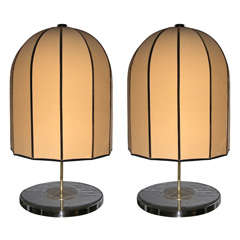 A pair of unusual chromed lamps with bell-shaped shades