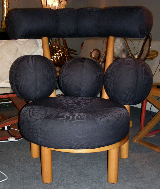 Two 1980s Norwegian armchairs by  Peter Opsvik in beechwood and fabric; three round independent fabric-covered spheres at lower back.